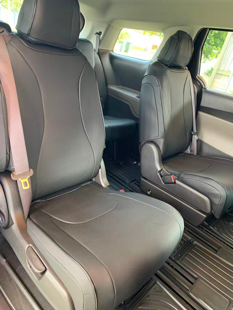 Black Kia Carnival seat covers fitted to the second-row seats