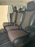Black and brown seat covers across the Kia Carnival second row