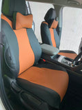 Black and orange Kia Carnival front seat covers in a right-hand-drive vehicle